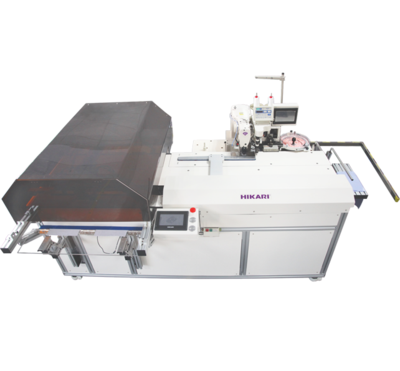 运用工业机器人技术的自动门襟钉扣机